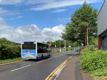 News bus on road image